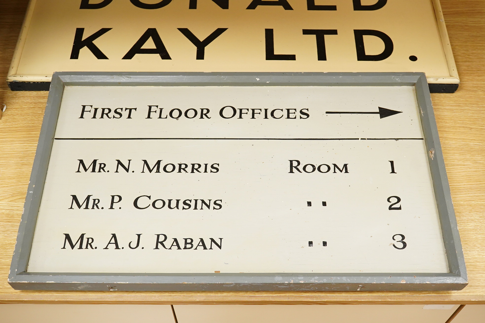 Three wooden signs, one a Metro sign, another First Floor offices, the other Donald Kay Ltd. Metro- 98cm